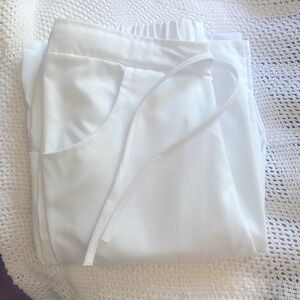 Brand new white scrubs, no need for them anymore